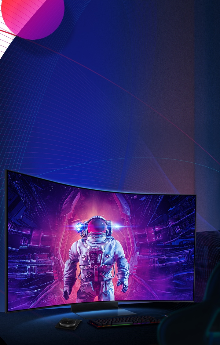 An astronaut in a spacesuit is standing in the middle with purple and pink light radiating around him on the monitor screen. Beneath the monitor is a keyboard, trackpad, Ark Dial and gaming chair.